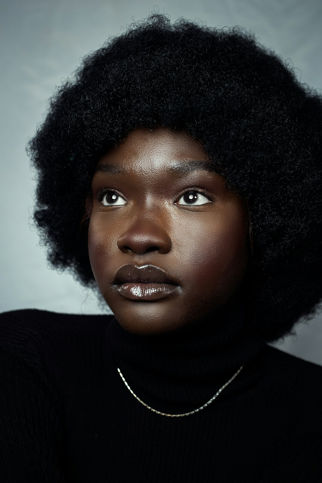 Studio portrait of a Black woman in her 30s