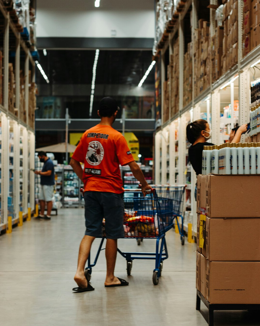 Warehouse workers checking inventory on shelves
